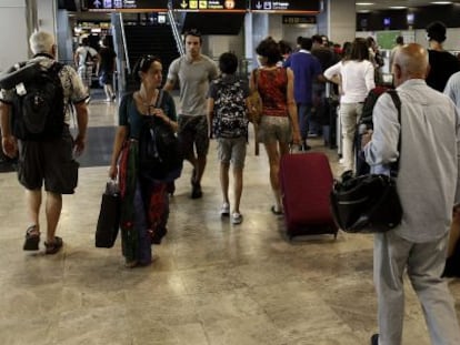 Passengers at Adolfo Suárez Madrid-Barajas International Airport.