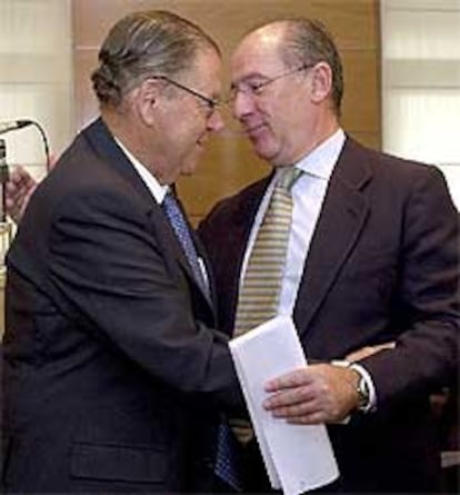 Enrique Aldama, a la izquierda, y Rodrigo Rato.