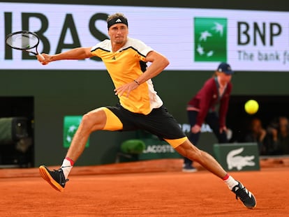 Germany's Alexander Zverev stretches to execute a forehand during his match against Nadal.