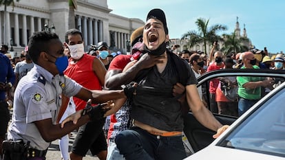 A man is arrested during protests in Havana on July 11.