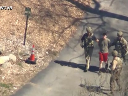 This image made from video provided by WCVB-TV, shows Jack Teixeira being taken into custody by armed tactical agents on April 13, 2023, in Dighton, Massachusetts.