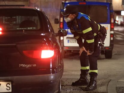 A police check in Salamanca, which has been put under a curfew.