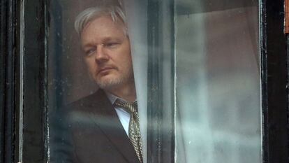 Julian Assange at the window of the Ecuadorian embassy in London; 2016.