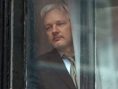 Julian Assange at the window of the Ecuadorian embassy in London; 2016.