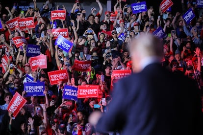 Attendees at Donald Trump's rally in Greensboro, North Carolina, with the candidate's back turned in the foreground.