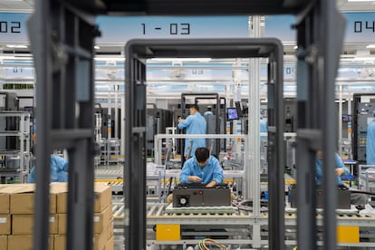 Technicians assemble DC charging piles for electric vehicles at a workshop in Hefei, Anhui province, China, Oct 13, 2023