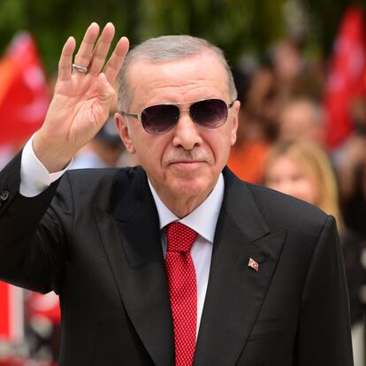 FILE - Turkish President Recep Tayyip Erdogan greets the people as arrives in the Turkish occupied area of the divided capital Nicosia, Cyprus, Monday, June 12, 2023. President Recep Tayyip Erdogan said in comments published Wednesday he remains firm on his unconventional approach to Turkey's economy, but suggested his recently appointed finance minister will have leeway to move away from policies many have blamed for a worsening cost-of-living crisis. (AP Photo/Nedim Enginsoy, File)
