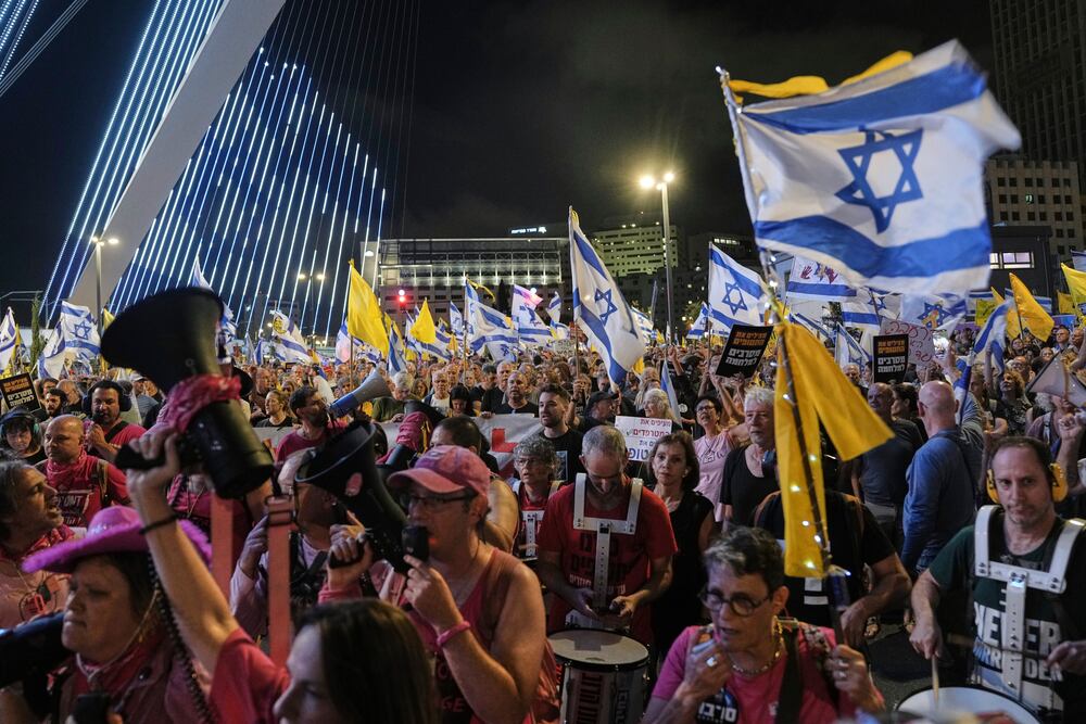 Relatives and supporters of Israeli hostages held in the Gaza Strip attend a rally demanding their release from Hamas captivity and calling for an end to the war, in Jerusalem, Saturday, Sept. 6, 2025. (AP Photo/Mahmoud Illean)