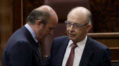 Guindos y Montoro, en el Congreso.