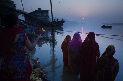 Indian Hindu devotees perform rituals in the the river Brahmaputra during the Chhath Puja festival in Gauhati, India, Thursday, Oct. 26, 2017. During Chhath, an ancient Hindu festival, rituals are performed to thank the Sun god for sustaining life on earth. (AP Photo/Anupam Nath)
