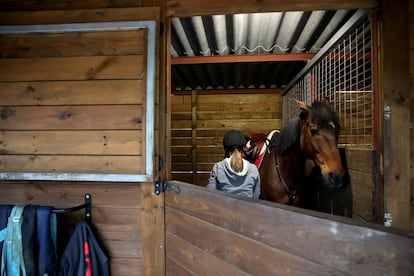 A rider with her horse at a riding stable in A Coruña, in Galicia.