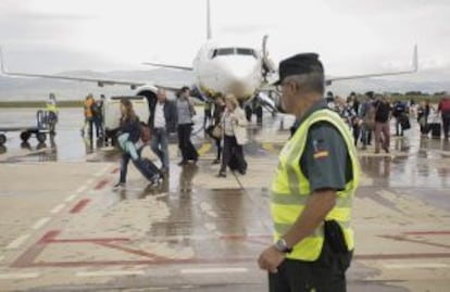 Passengers disembark from the Ryanair flight.