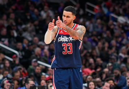 Washington Wizards forward Kyle Kuzma gestures to teammates during the second half of an NBA basketball game against the Sacramento Kings on March 18, 2023, in Washington.