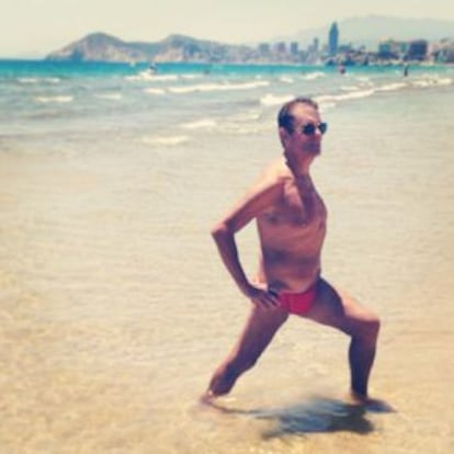 A man exercises on the beach at Benidorm.