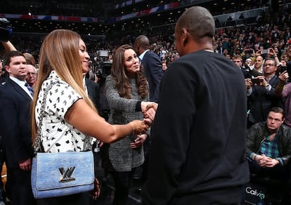 NBA handout photo shows Britain's Catherine being greeted by Beyonce and Jay-Z at a NBA basketball game in New York