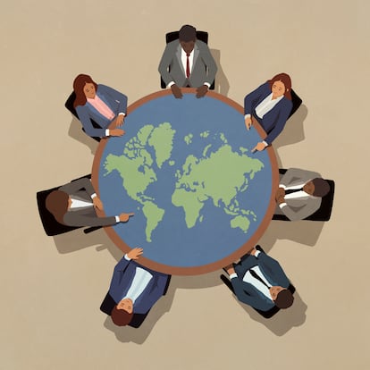 Business leaders meeting around round globe table