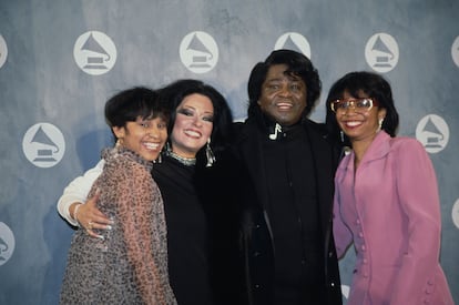 (From left to right) James Brown with his daughter Yamma, his third wife, Adrienne Rodrigruez and daughter, Deanna at the 34th Grammy Awards, in New York City’s Radio City Music Hall on February 25, 1992.