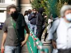 People wait in line outside San Giovanni hospital to get tested for COVID-19, in Rome on Oct. 8, 2020. Europe’s second wave of coronavirus infections has struck well before flu season even started. People waited in line for 8-10 hours to get tested, while front-line medics from Kiev to Paris found themselves once again pulling long, short-staffed shifts in overcrowded wards. (AP Photo/Gregorio Borgia)