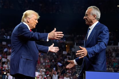 Donald Trump welcomes Robert F. Kennedy Jr. to the stage at a rally in Arizona.