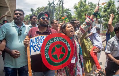 A protester holds a placard during the first day of protests organised by the Anti-Discrimination Students Union at the Dhaka University campus. 