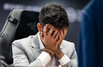 Gukesh covers his face after realizing that he is technically lost in the first game of the World Cup