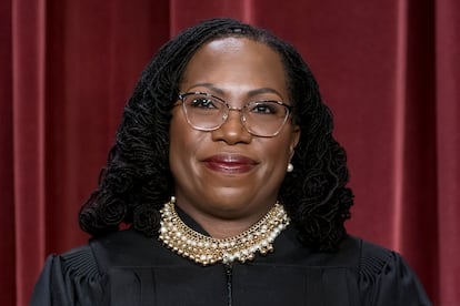 Associate Justice Ketanji Brown Jackson stands as she and members of the Supreme Court pose for a new group portrait following her addition, at the Supreme Court building in Washington, Oct. 7, 2022.