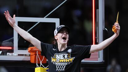 Caitlin Clark of the Iowa Hawkeyes cuts down the net after beating the LSU Tigers 94-87 in the Elite 8 round of the NCAA Women's Basketball Tournament at MVP Arena on April 01, 2024 in Albany, New York.