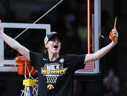 Caitlin Clark of the Iowa Hawkeyes cuts down the net after beating the LSU Tigers 94-87 in the Elite 8 round of the NCAA Women's Basketball Tournament at MVP Arena on April 01, 2024 in Albany, New York.