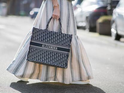 DUSSELDORF, GERMANY - FEBRUARY 05: (EDITORS NOTE: Image has been digitally enhanced.) Alexandra Lapp is seen wearing CHRISTIAN DIOR Cruise collection 2021, CHRISTIAN DIOR striped maxi skirt in white and grey, personalized CHRISTIAN DIOR Book Tote bag in navy blue printed with influencers name ALEXANDRA on February 05, 2021 in Dusseldorf, Germany. (Photo by Christian Vierig/Getty Images)