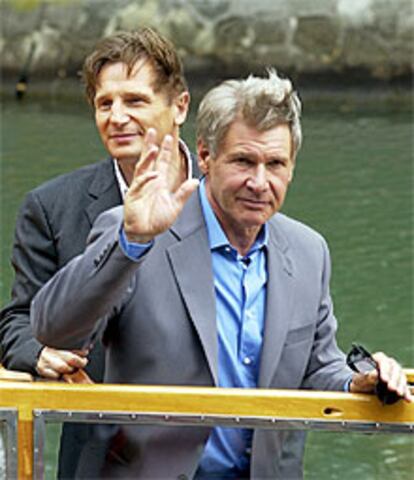 Los actores Harrison Ford, delante, y Liam Neesom en Venecia.