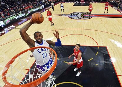 Eastern Conference's LeBron James, of the Cleveland Cavaliers, (23) slam dunks the ball against the Western Conference during second half NBA All-Star Game basketball action in Toronto on Sunday, Feb.14, 2016. (Bob Donnan/The Canadian Press via AP. Pool) 