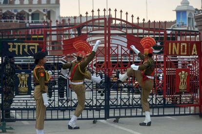 This photo taken on February 20, 2017 shows Indian Border Security Force (BSF) personnel symbolically slamming gates shut as they perform during the daily beating of the retreat ceremony on the India-Pakistan Border at Wagah.
Built to keep out migrants, traffickers, or an enemy group, border walls have emerged as a one-size-fits-all response to the vulnerability felt by many societies in today's globalized world, says an expert on the phenomenon.
Practically non-existent at the end of World War II, by the time the Berlin Wall fell in 1989 the number of border walls across the globe had risen to 11.
That number has since jumped to 70, prompted by an increased sense of insecurity following the September 11, 2001 attacks in the United States and the 2011 Arab Spring, according to Elisabeth Vallet, director of the Observatory of Geopolitics at the University of Quebec in Montreal (UQAM).

This image is part of a photo package of 47 recent images to go with AFP story on walls, barriers and security fences around the world. More pictures available on afpforum.com / AFP PHOTO / NARINDER NANU