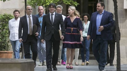 Catalan Premier Carles Puigdemont leads fellow Catalan political leaders outside the regional congress on Monday.