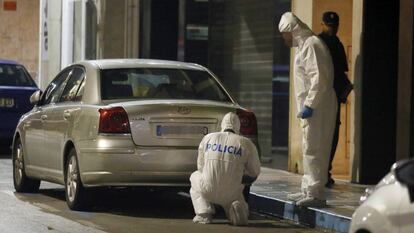 Police inspect the neighborhood where the crime occurred.