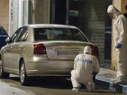 Police inspect the neighborhood where the crime occurred.