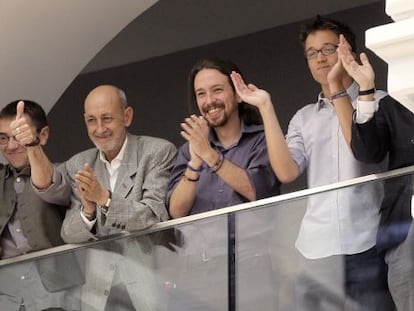 Podemos members (from left to right) Juan Carlos Monedero, Jesús Montero, Pablo Iglesias and Íñigo Errejón applaud the investiture of Manuela Carmena.