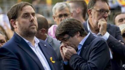 Oriol Junqueras (L) and Carles Puigdemont at a protest march on Saturday.