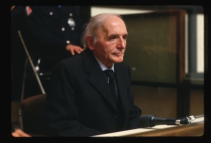 Former Gestapo officer Klaus Barbie sits behind a glass screen before the Lyon Assize court at the opening of his trial. Barbie is accused of crimes against humanity