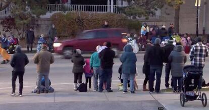 A red SUV speeds past attendees moments before plowing into a crowd at a Christmas parade in Waukesha, Wisconsin, U.S., in this still image taken from a November 21, 2021 social media video. CITY OF WAUKESHA/Facebook/via REUTERS THIS IMAGE HAS BEEN SUPPLIED BY A THIRD PARTY. MANDATORY CREDIT. NO RESALES. NO ARCHIVES.