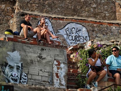 Graffiti attacking tourism in Barcelona at the El Carmel former anti-aircraft batteries on the outskirts of the city.