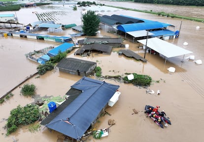 Rescue workers take part in a rescue operation at a town submerged by typhoon Khanun in Daegu, South Korea, on August 10, 2023.