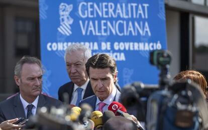 Industry Minister Soria (r) speaks to the press after visiting the Castor plant.
