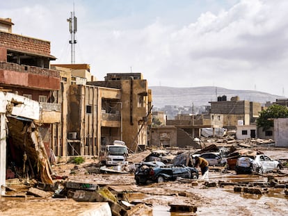 A view of destroyed vehicles and damaged buildings in the eastern city of Benghazi in the wake of the Mediterranean storm Daniel.