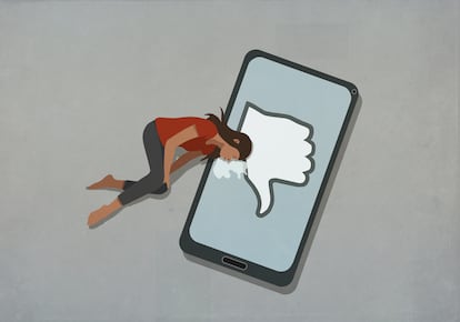 Crying woman laying on smart phone with social media dislike button
