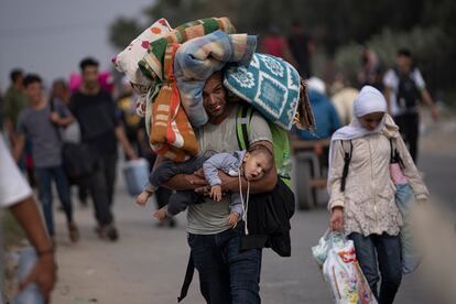 Palestinians flee to the southern Gaza Strip on Salah al-Din Street in Bureij, Gaza Strip, Saturday, Nov. 11, 2023