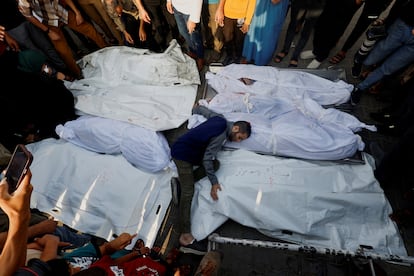 People take part in the funeral of Palestinians killed in Israeli strikes in Khan Younis