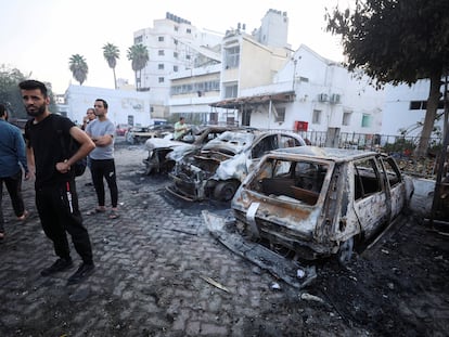 FILE PHOTO: People inspect the area of Al-Ahli hospital where hundreds of Palestinians were killed in a blast that Israeli and Palestinian officials blamed on each other, and where Palestinians who fled their homes were sheltering amid the ongoing conflict with Israel,  in Gaza City, October 18, 2023.  REUTERS/Mohammed Al-Masri/File Photo