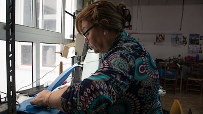 María Luisa del Amo sewing face masks at home.