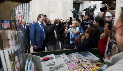 Rajoy poses for a photo with a member of the public in Melilla on Thursday.