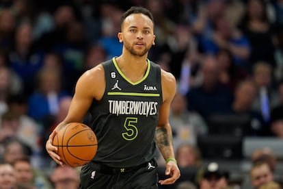 Minnesota Timberwolves forward Kyle Anderson (5) dribbles down the court during the first half of an NBA basketball play-in tournament game against the Oklahoma City Thunder, Friday, April 14, 2023, in Minneapolis.